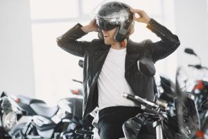 Handsome man choosing a motorcycle to buy